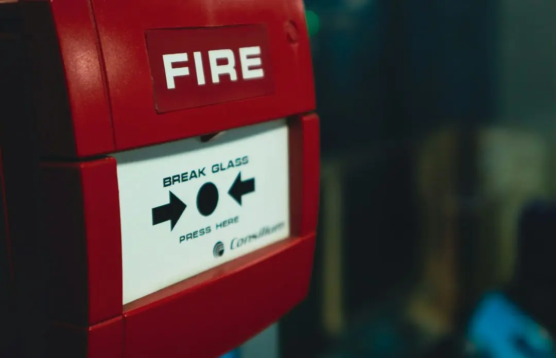 Red break-glass fire alarm call point